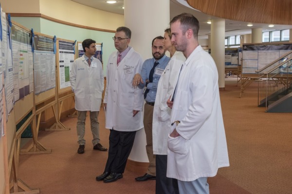 Image of residents looking at poster presentations