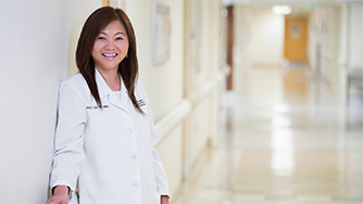 A Cleveland Clinic caregiver standing in a hallway