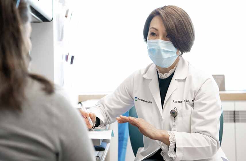 Cleveland Clinic physician Rosanne Kho, MD talks to a female patient