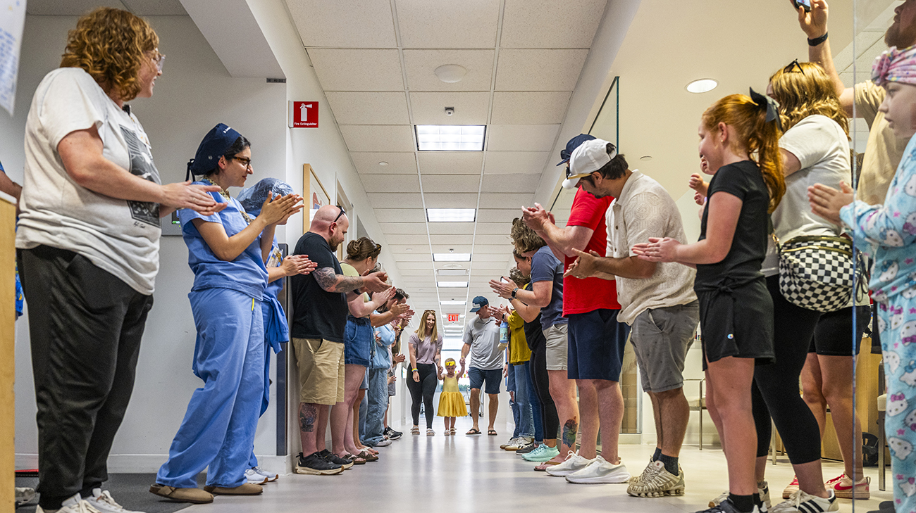 Cleveland Clinic Children's caregivers and family members gather to celebrate Miley ringing the Bravery Bell at Cleveland Clinic Children's.