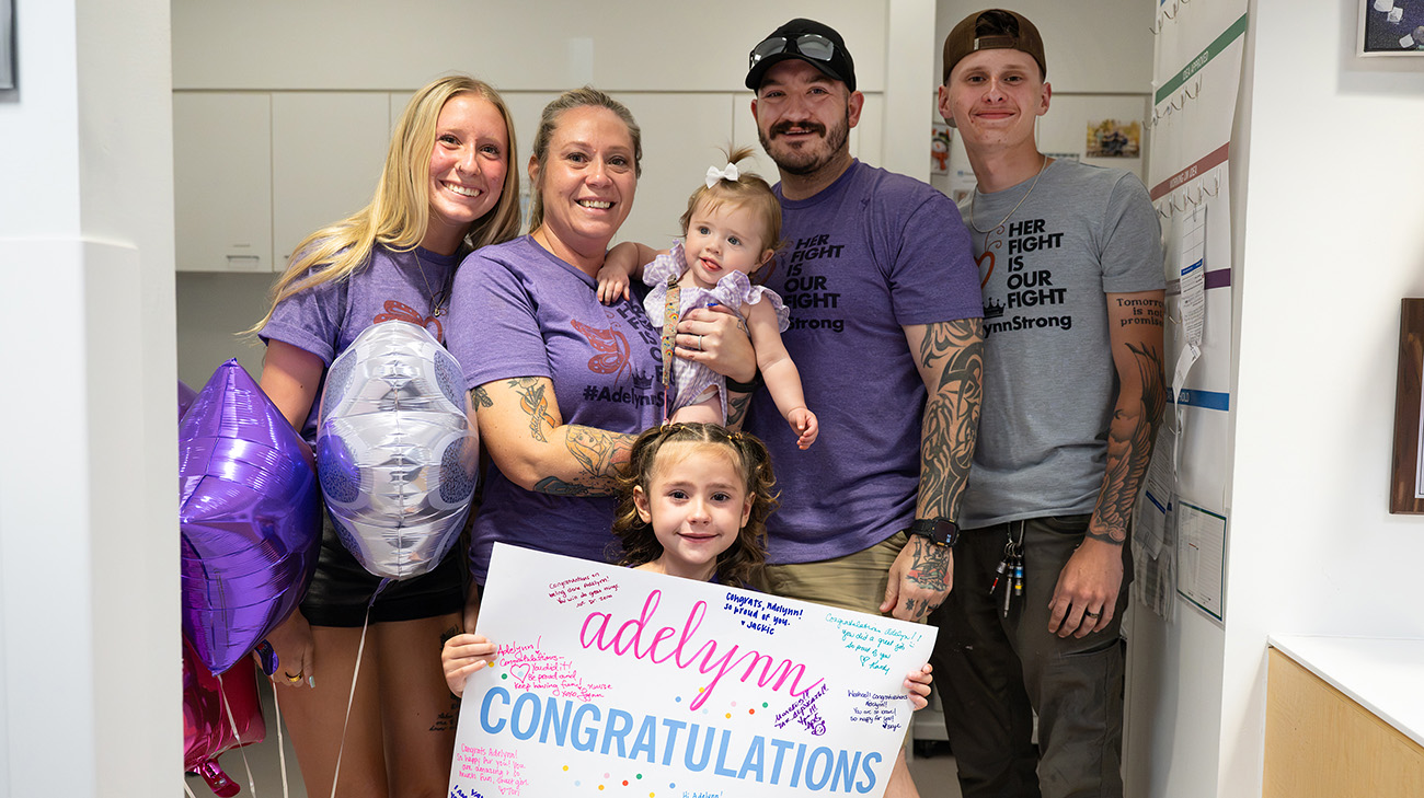 Adelynn with family at bell ringing