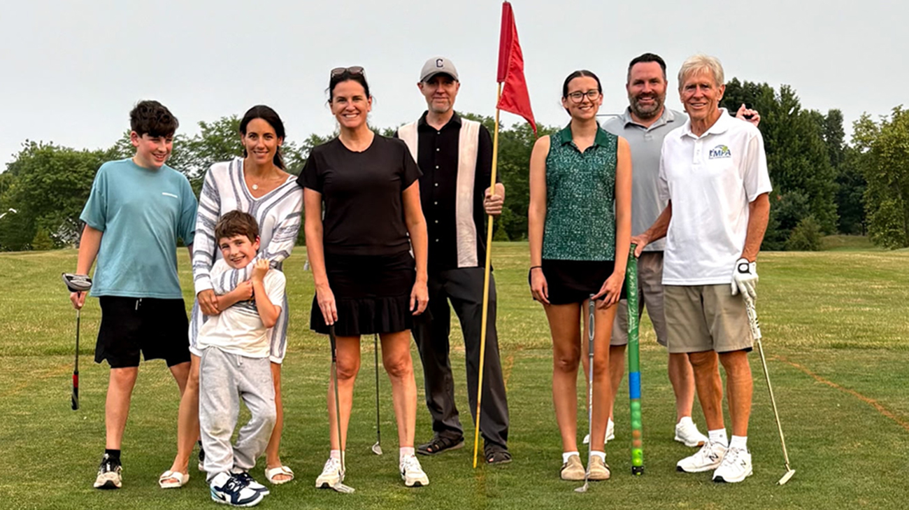 Tom Bruckman with his family playing golf. 