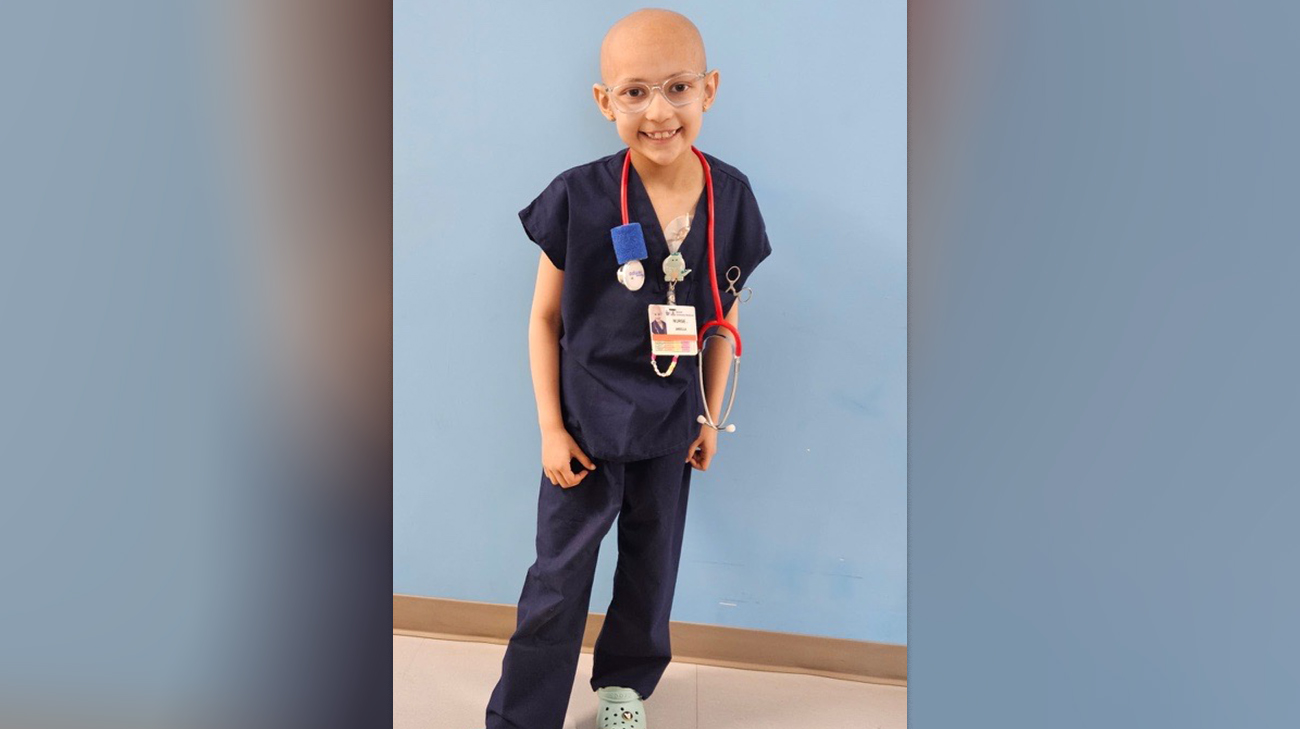 Ariella dressed up as a doctor during cancer treatment. 