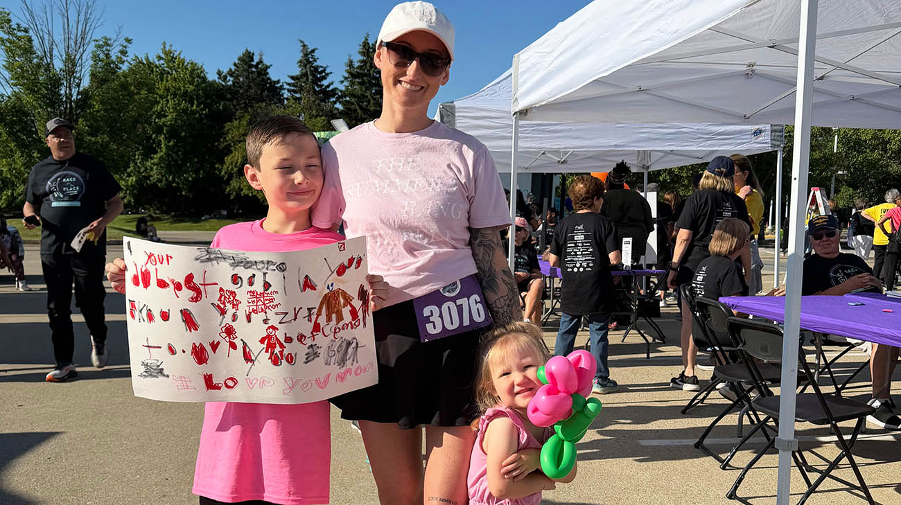 Kristie with her two kids raising awareness for breast cancer.