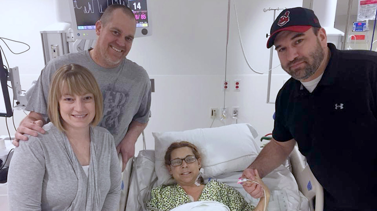 Carole recovering in the hospital about one week post transplant, surrounded by her husband, Trent (far right), Jason (middle), and his wife, Stephanie (far left), about one week post transplant. 
