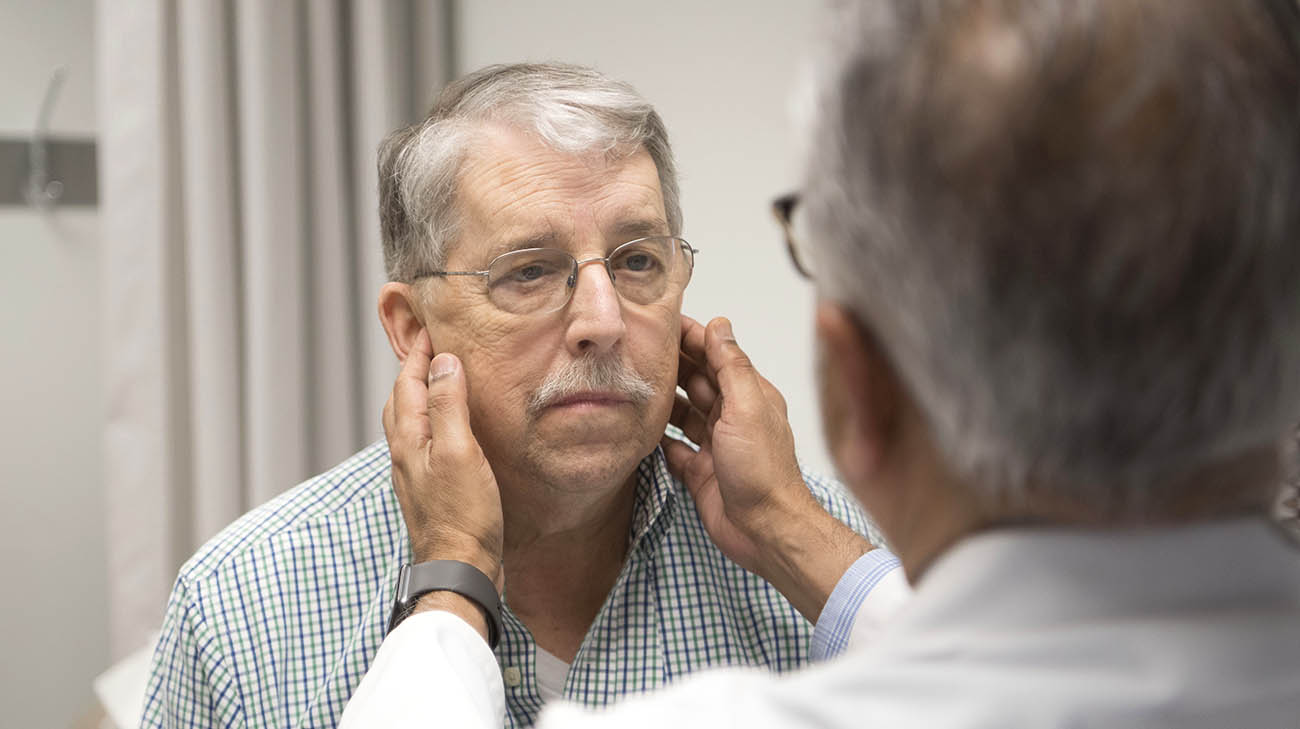 Dr. Atul Mehta and lung transplant patient, Dan Lynch, during a follow-up appointment. 