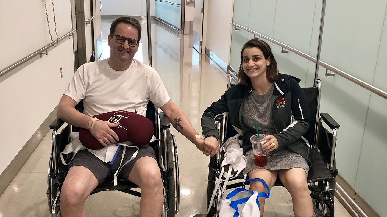 Jim and Amanda hold hands are they get ready to be discharged from Cleveland Clinic. (Courtesy: Amanda Egli)