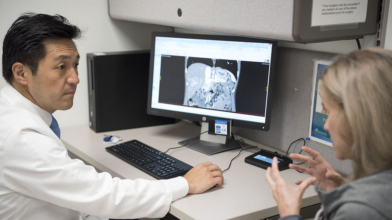 Rachel and Dr. Kwon go over her scans after surgery. (Courtesy: Cleveland Clinic)