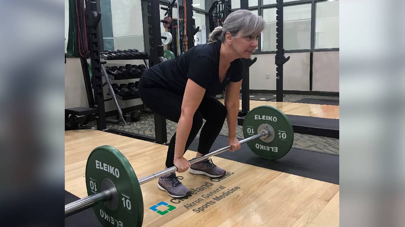 Michele Pamboukis lifting weights at Akron General’s Adult Strength and Conditioning program.