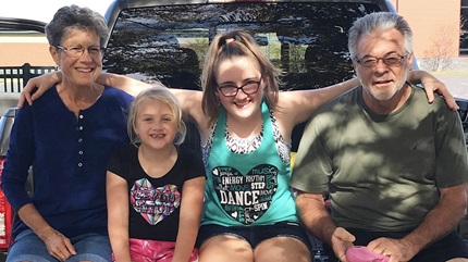 Cindy with her granddaughters and husband, Ron. (Courtesy: Cindy Catlett)