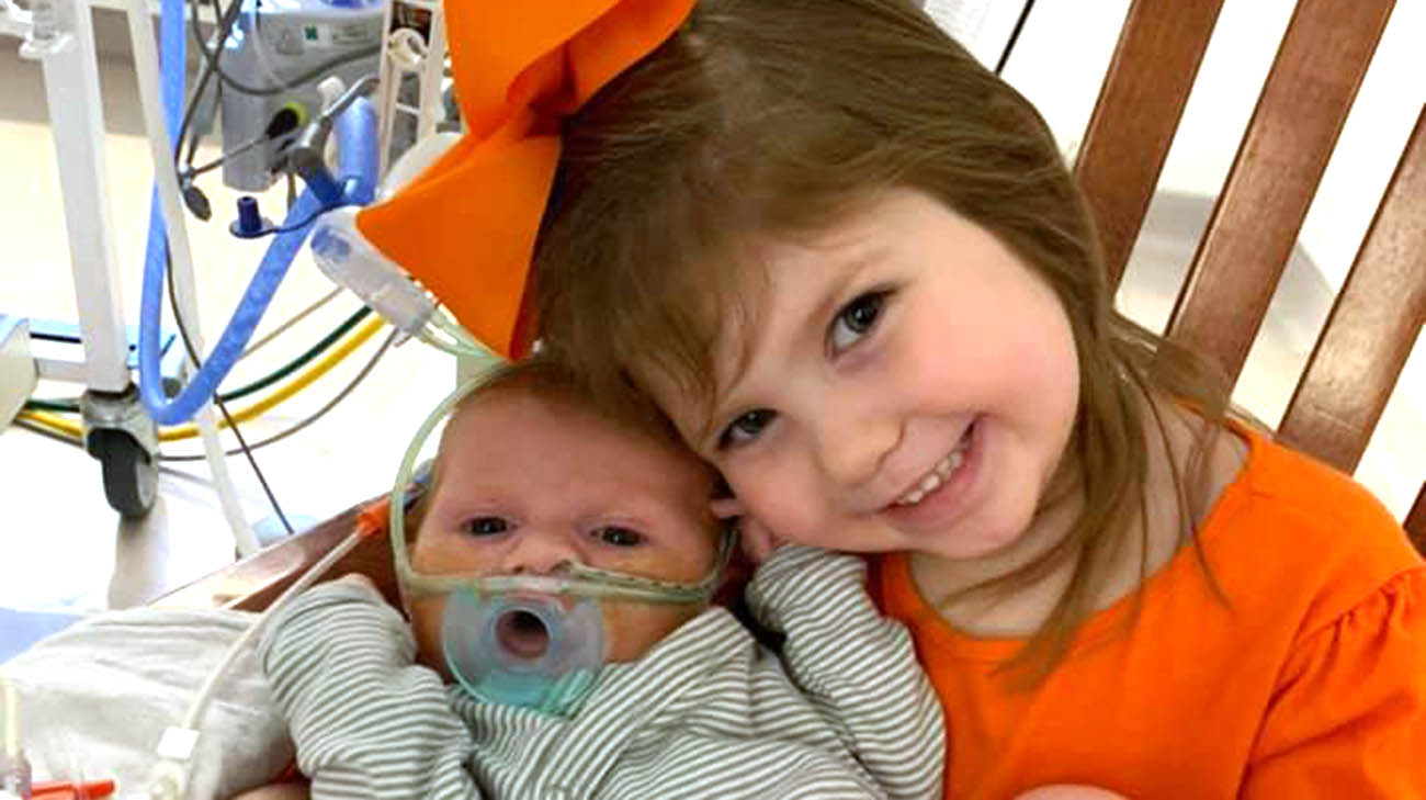 Carson with his sister Aubree, after surgery, at Cleveland Clinic Children's. 