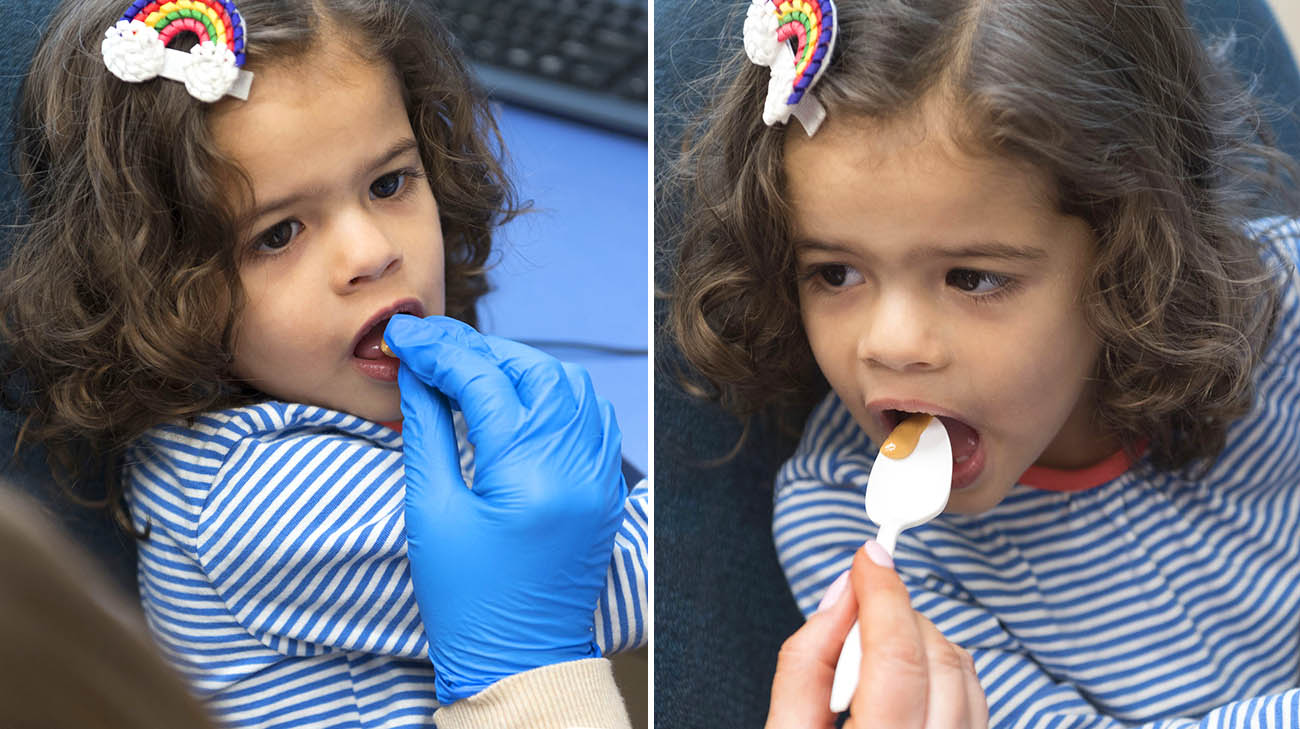 Harper consuming cashews during one of her treatment sessions at Cleveland Clinic Food Allergy Center of Excellence. 