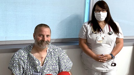 Patient Jon Joesten, with Chelsea Kelly, RN, who saved him while he was suffering a heart attack outside his home. 