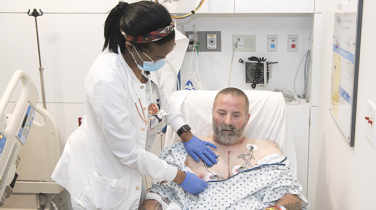 Jon Joesten with nurse, Ja'Nae Morris, after undergoing a triple bypass surgery at Cleveland Clinic. 