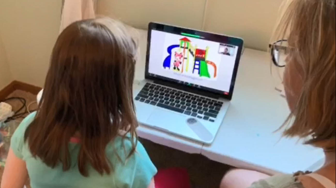 Maya virtually attending one of her Lerner School for Autism classes. 