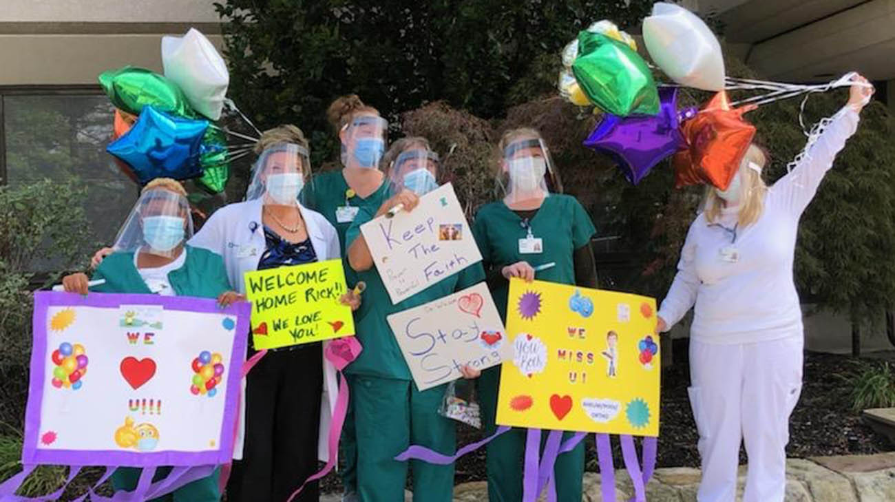 Cleveland Clinic caregivers gathered to welcome Dr. Rick Wilson, after he left the hospital.