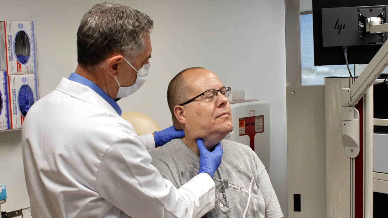 Dr. Claudio Milstein performing laryngeal manipulation. 