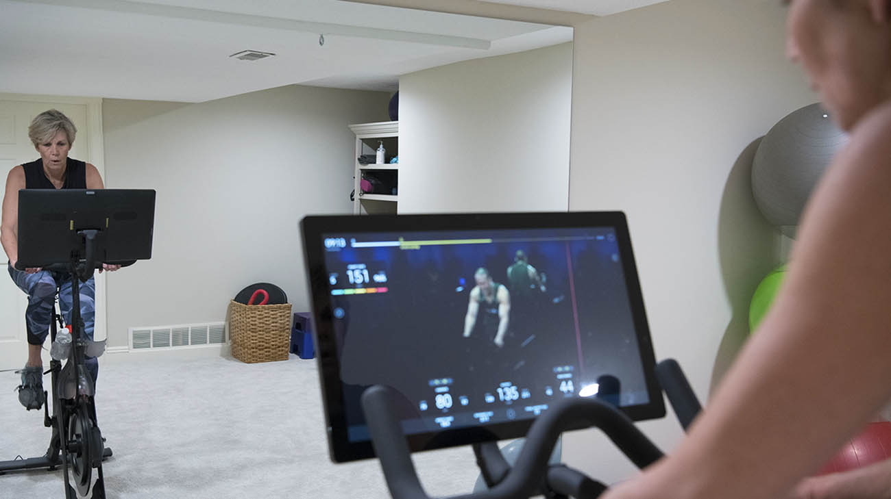 Sally riding her stationary bike to help with Parkinson's research related to aerobic exercise. 