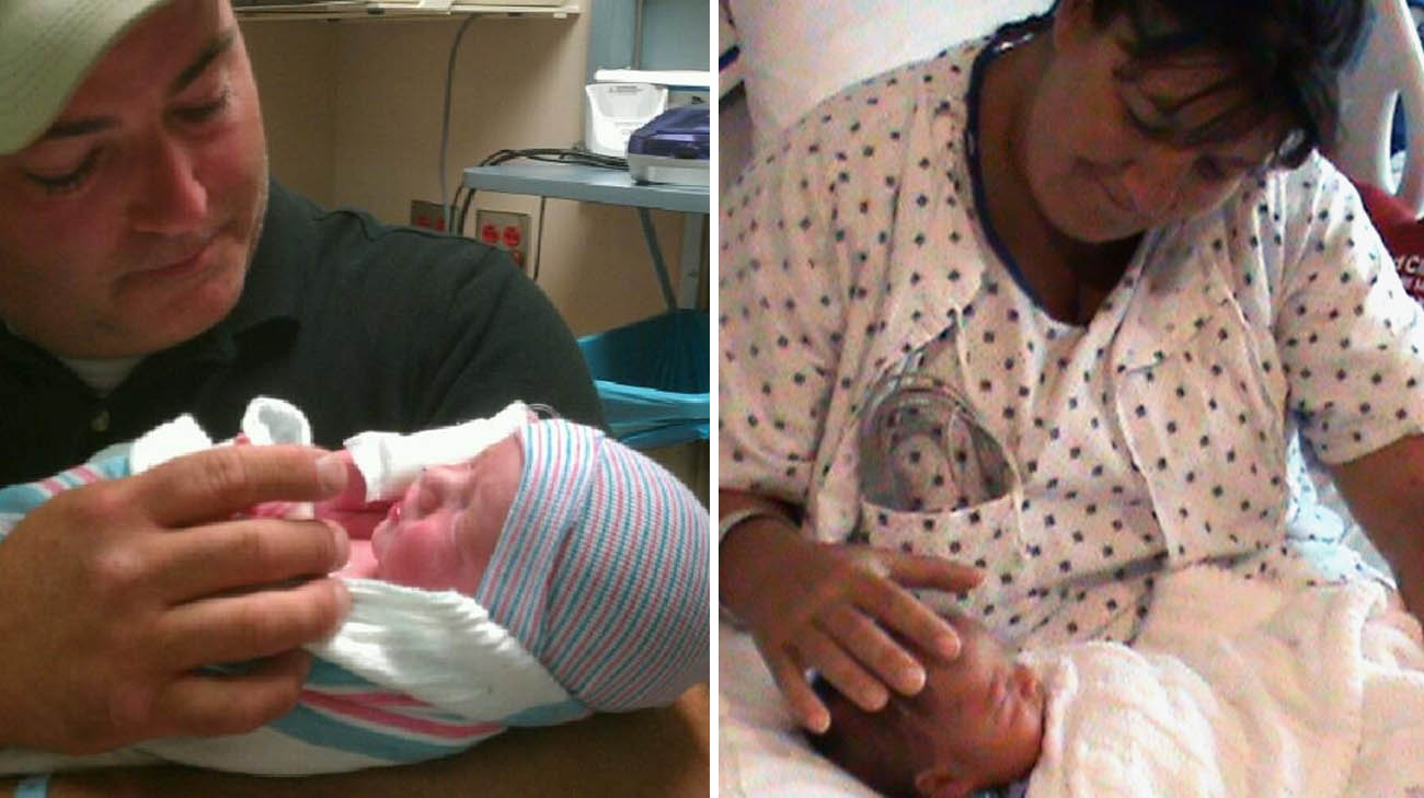 Tammie and Scott holding Liam.