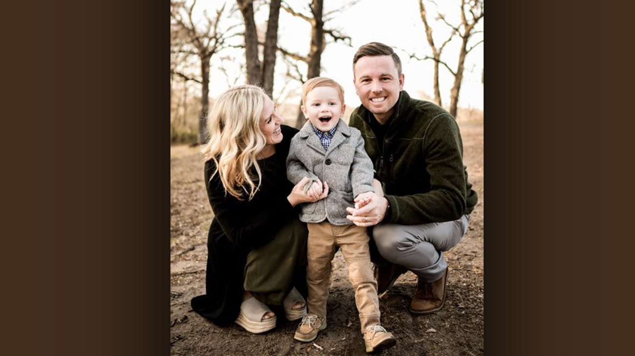 Hudson Board with his parents, Sarah and Adam Board.