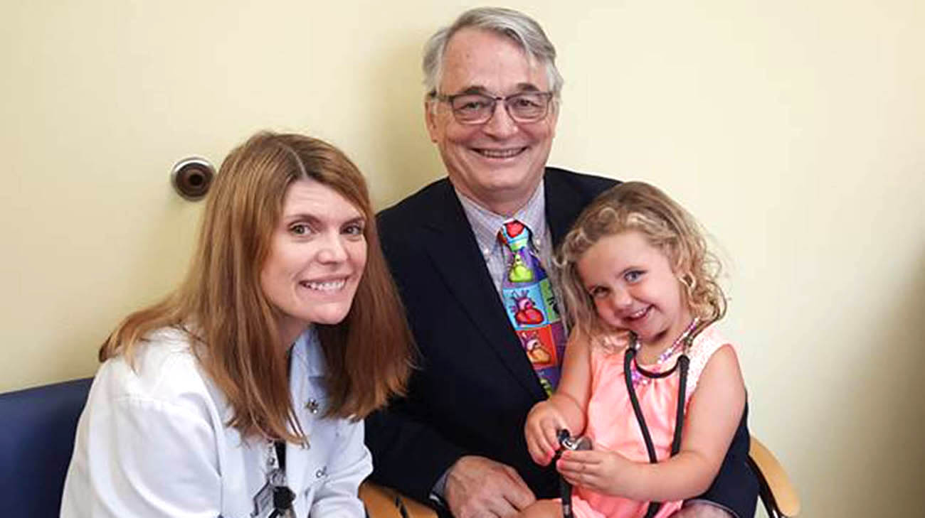 Alivia with Dr. Gerard Boyle and a Cleveland Clinic caregiver.