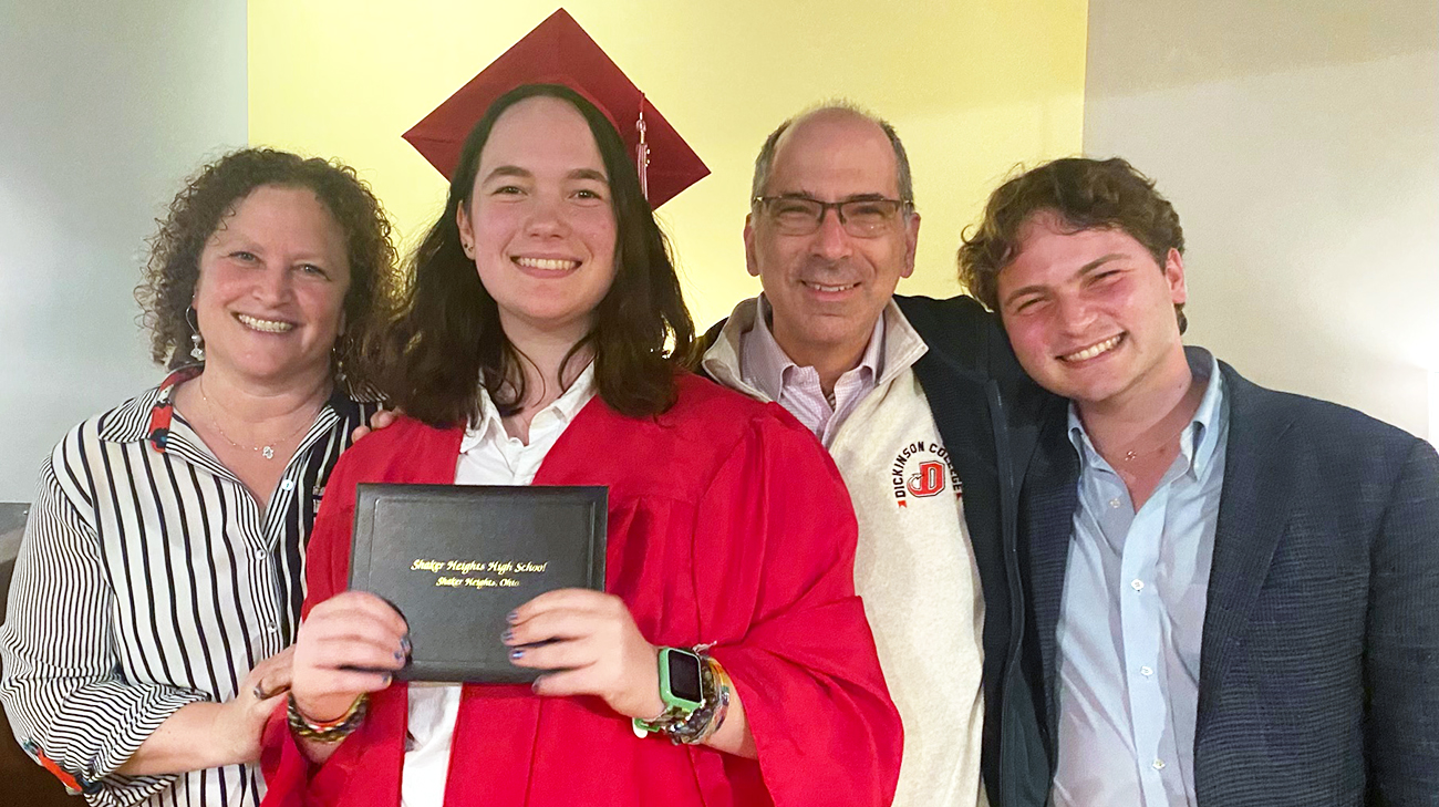 Rob with his wife, daughter and son, at his daughter's high school graduation in June 2024. 