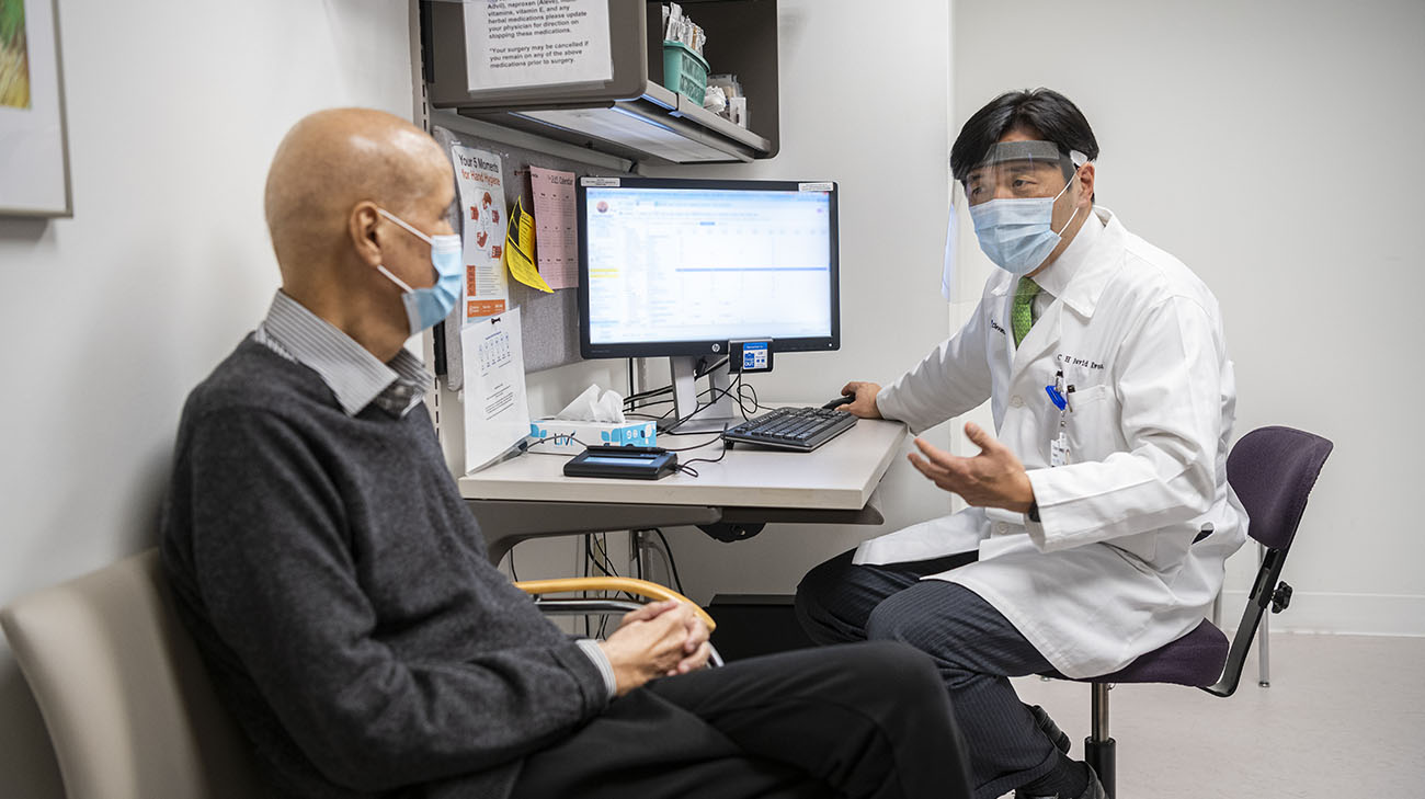 Dr. Kwon performs one final examination before Dr. Paudyal returns home to Nepal.