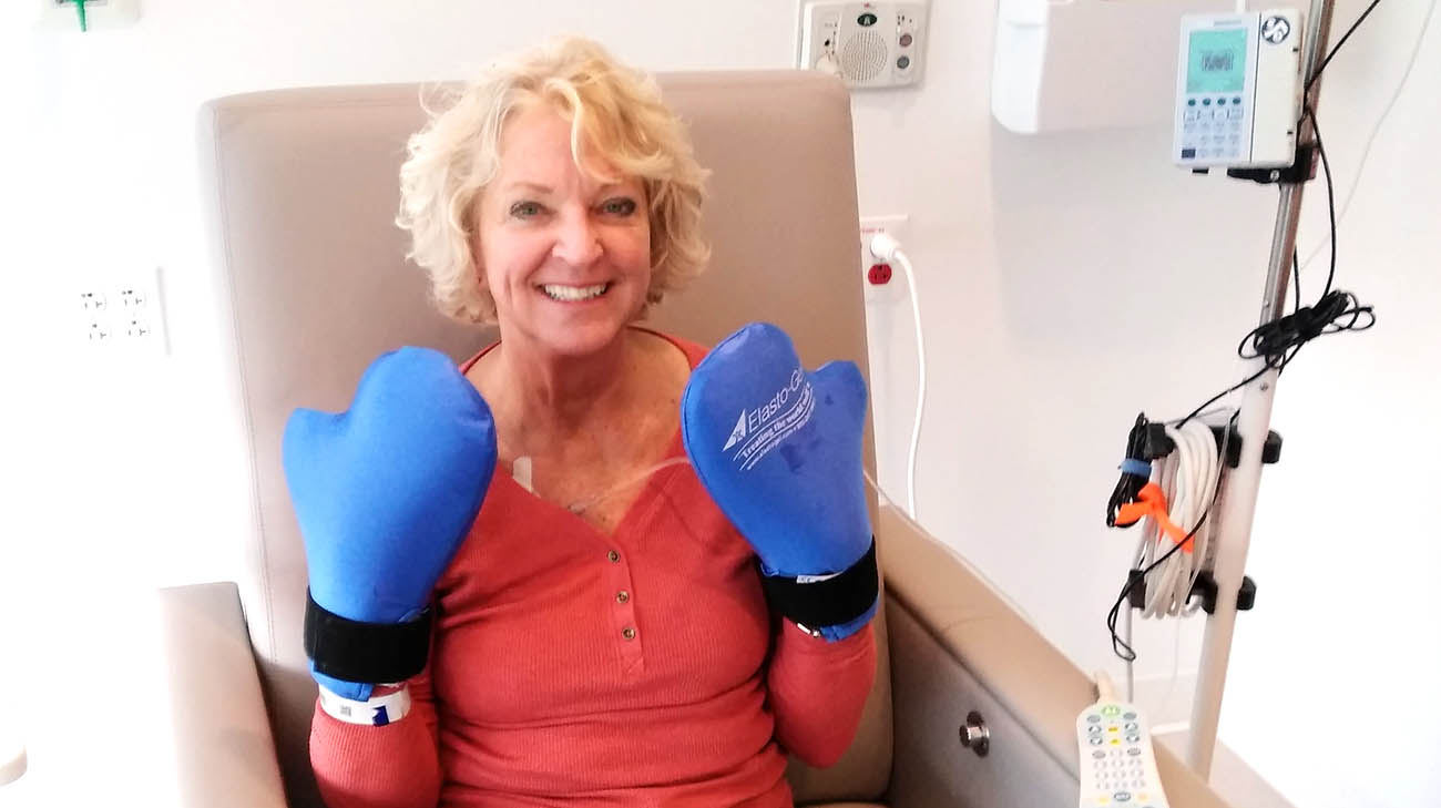 Cindi used blue mittens to prevent chemotherapy from reaching the nerve endings of her hands.