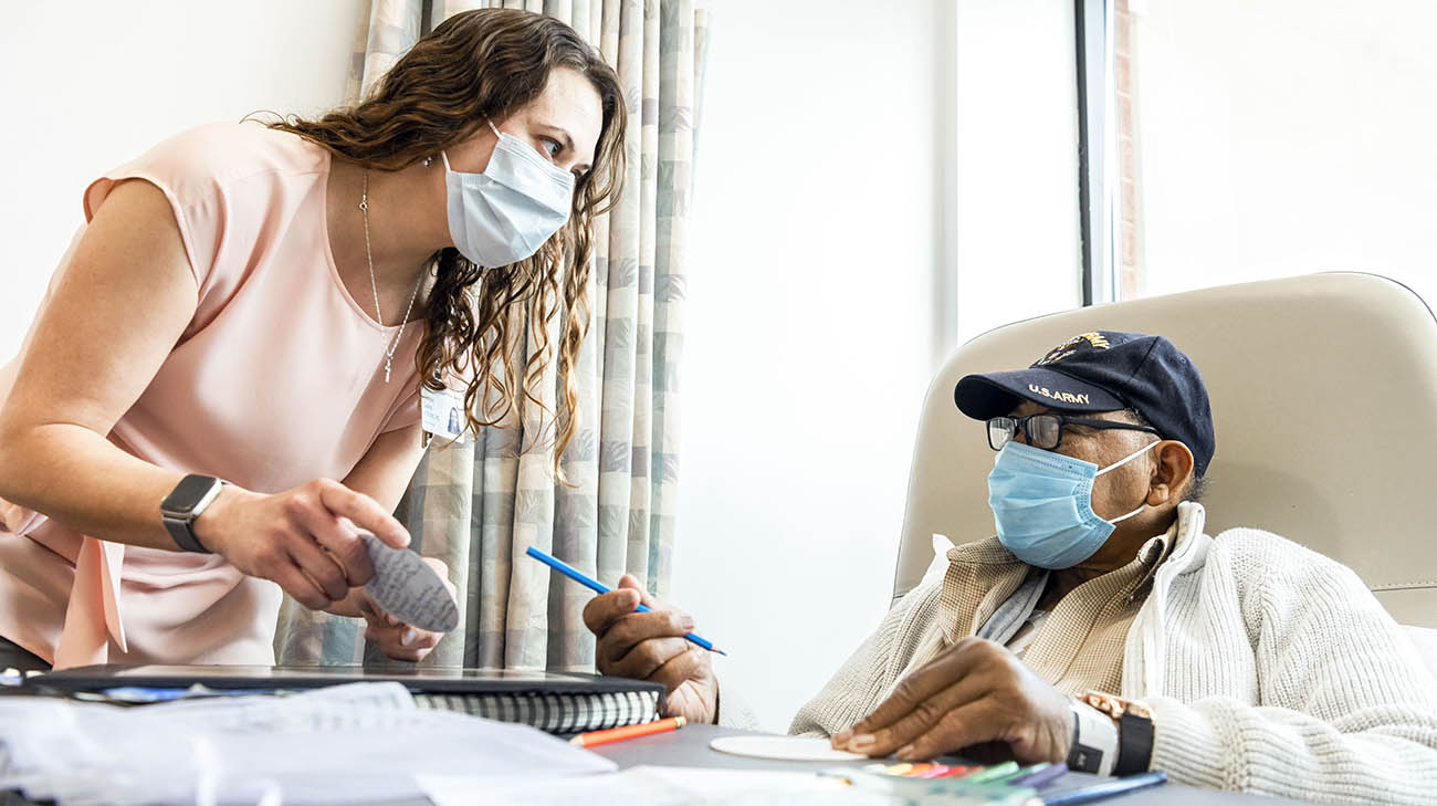 Ned with Cleveland Clinic art therapist, Amber Gano, during a treatment session. 