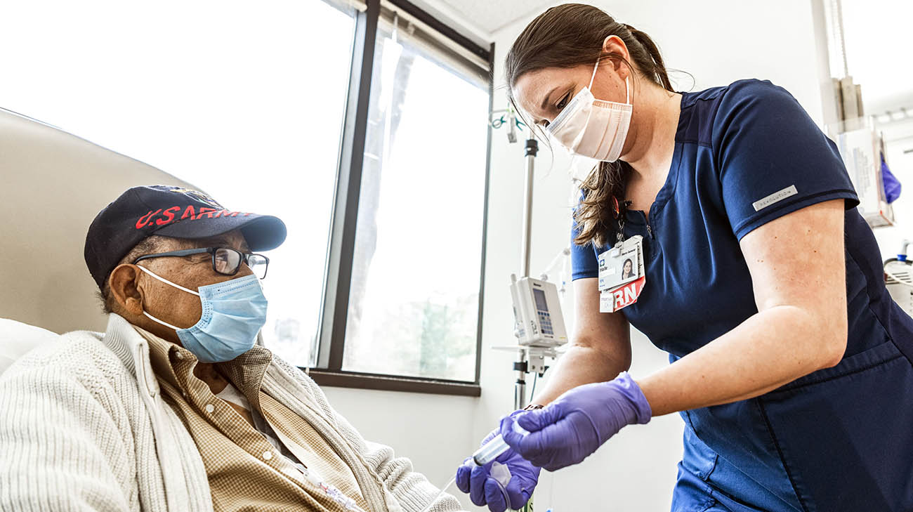 A Cleveland Clinic nurse preparing Ned for infusion. 