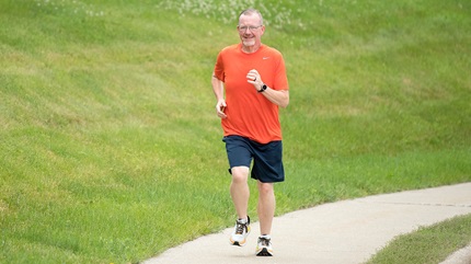 Terry Price running on paved trail.