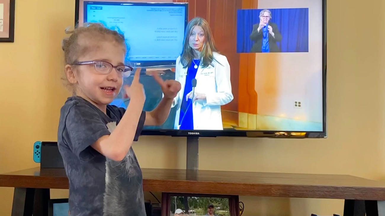 Jacoby signs with the interpreter during Governor DeWine's press conferences about coronavirus. 