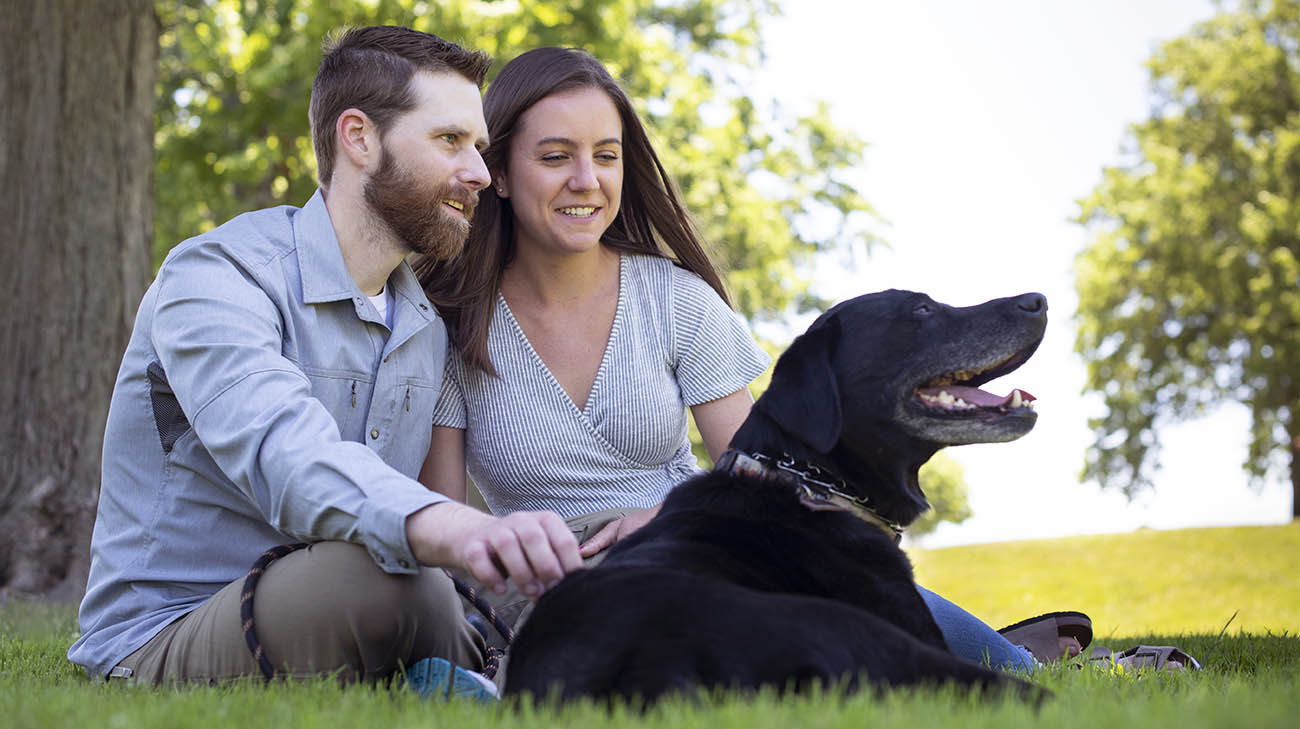 Multi-organ transplant patient, Andy Voge, with his wife, Rachel, and their dog, Cooper. 