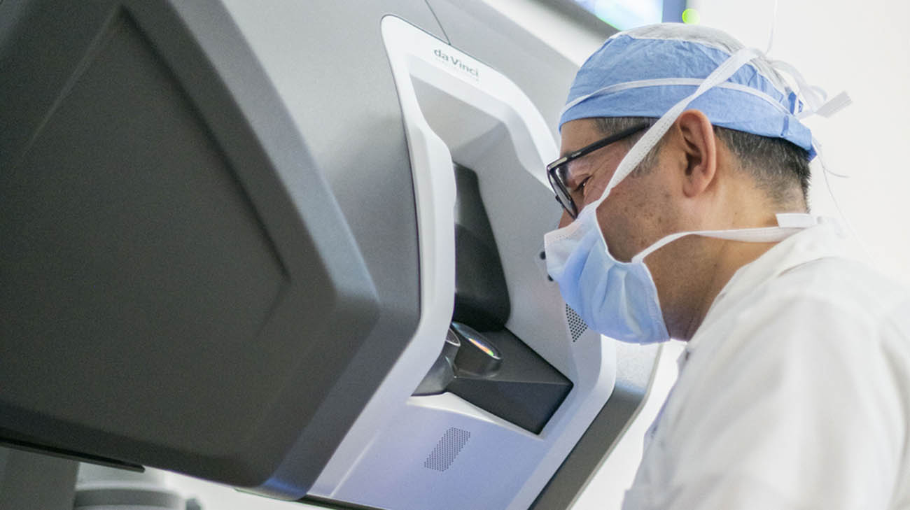 Dr. Jihad Kaouk looking through a robotic system at Cleveland Clinic. 