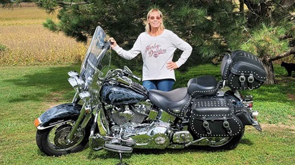 Tamara Oberdorf next to her motorcycle. 