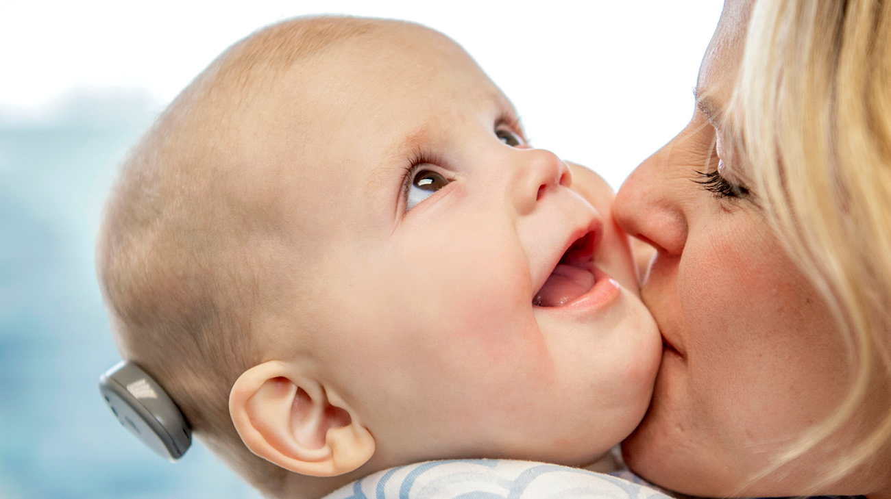 Corbin's mom giving him a kiss.