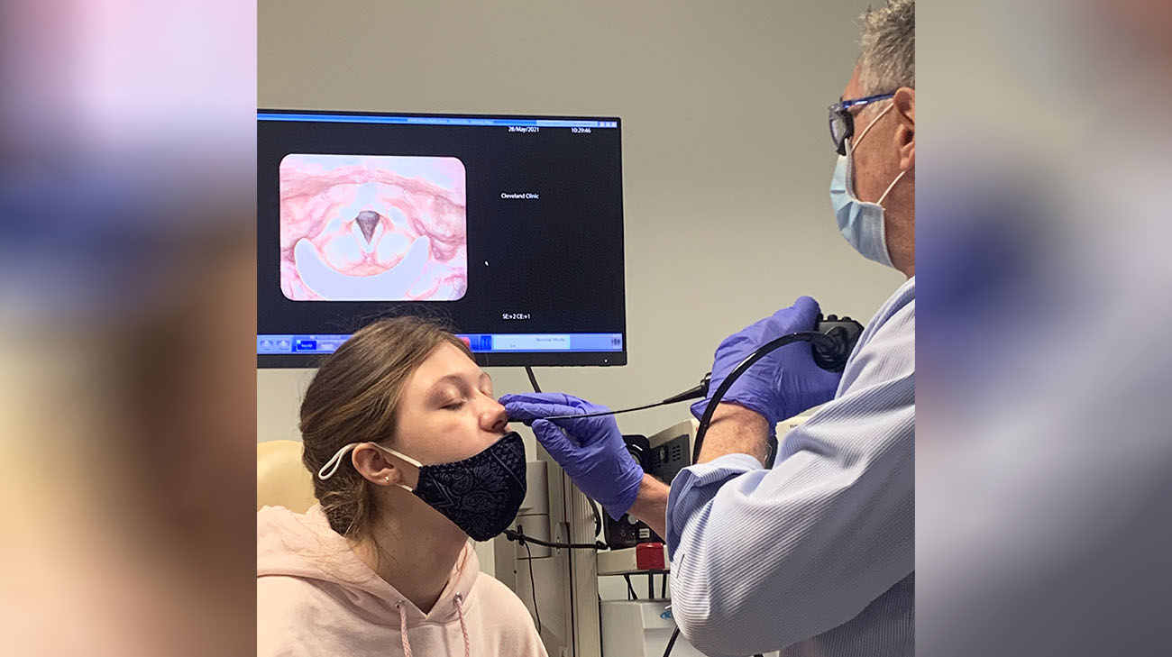 Dr. Claudio Milstein inserts a camera into Maya's nose to diagnose her breathing problem. 