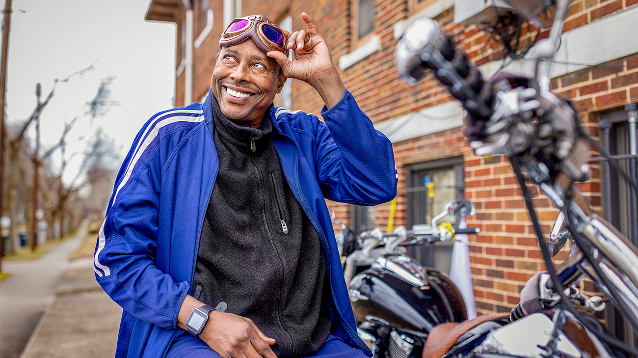 Roy Humphrey smiling on his motorcycle.