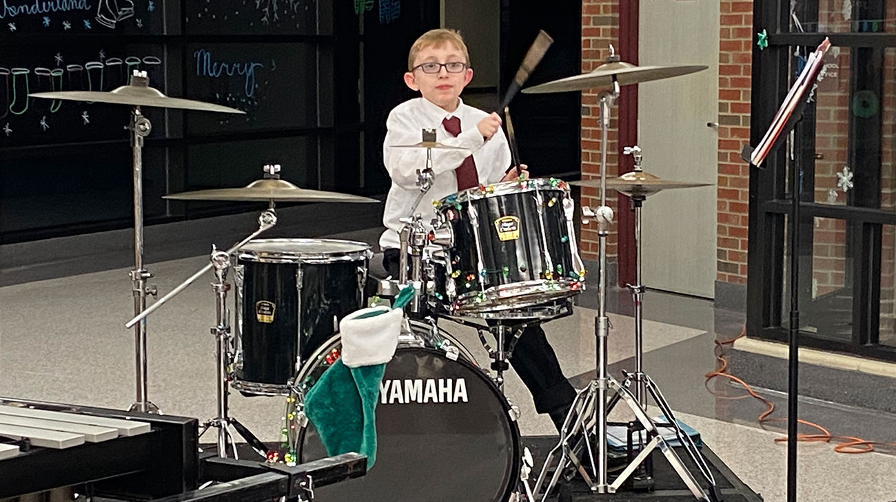 William Garrott playing the drums.
