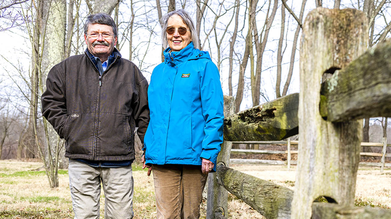 Sue and Jay Giles in front of their home in Burton, Ohio. 