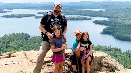 Carmen with his wife and two daughters before his cancer treatment.