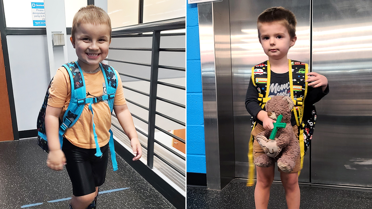 Johnny and Oliver at therapy, posing for a photo with their backpacks.
