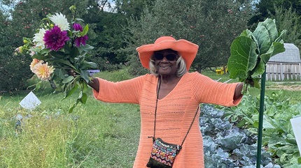 Patient, Vel Scott, enjoys gardening in her Purple Oasis, a community-based urban garden in University Circle.