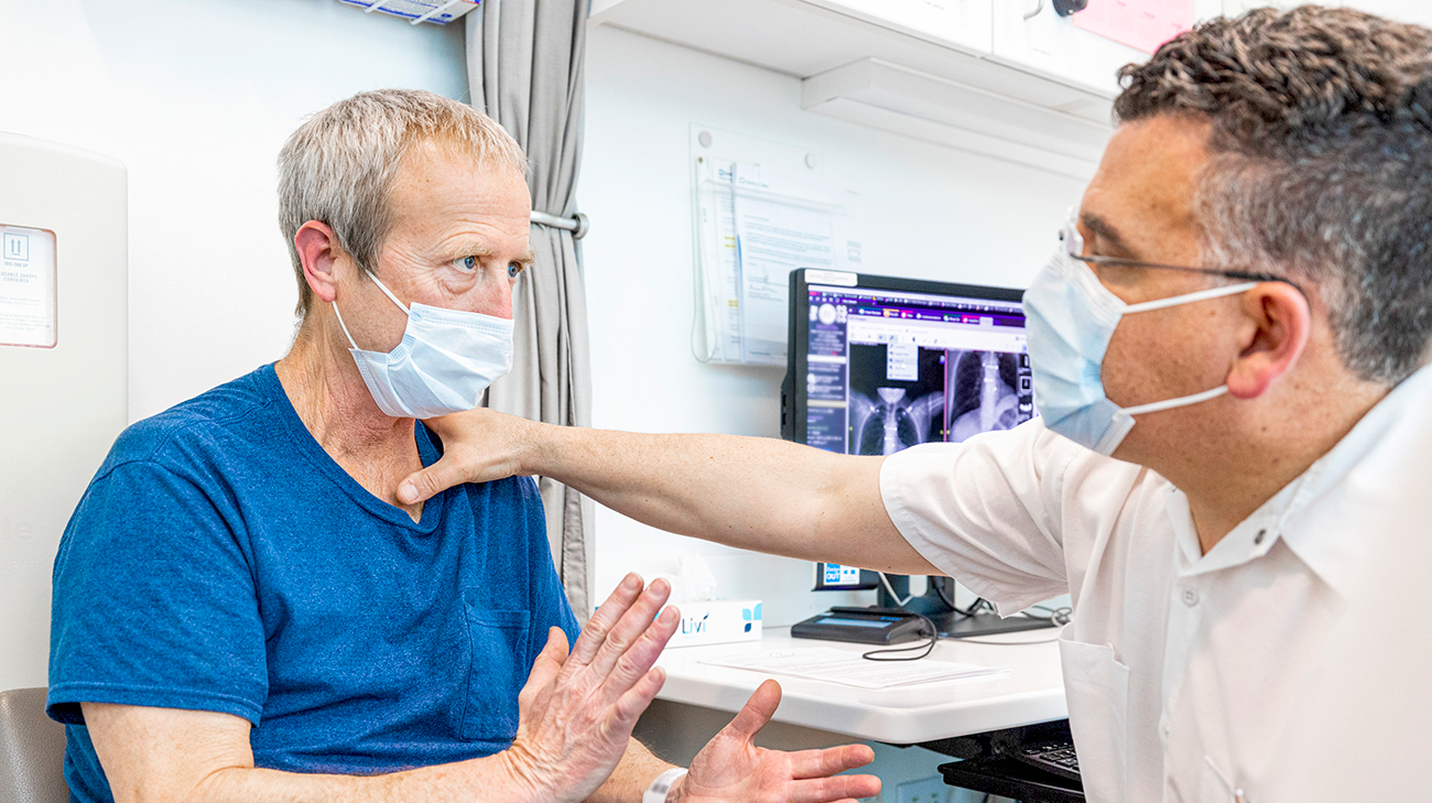 Edward and Dr. Daniel Raymond at a follow-up appointment. 