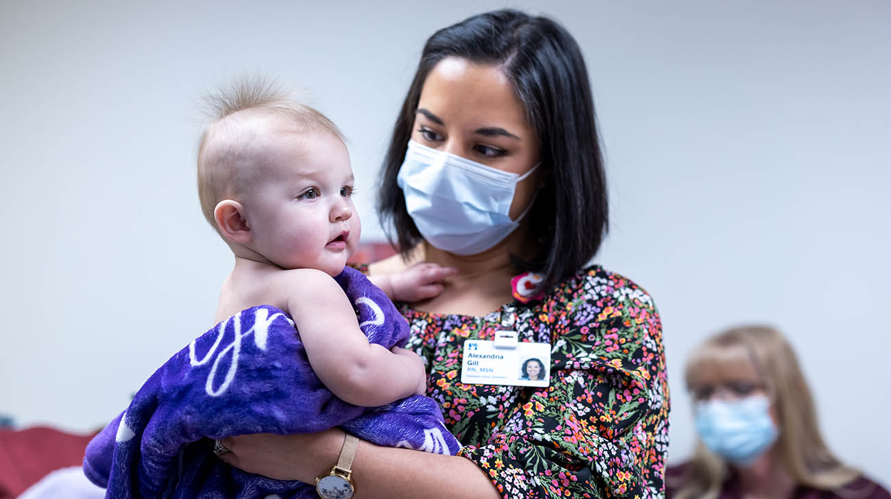 Pediatric heart patient Grace Wheeler with Infant High Risk Home Monitoring Program care coordinator and registered nurse Lexi Gill. 