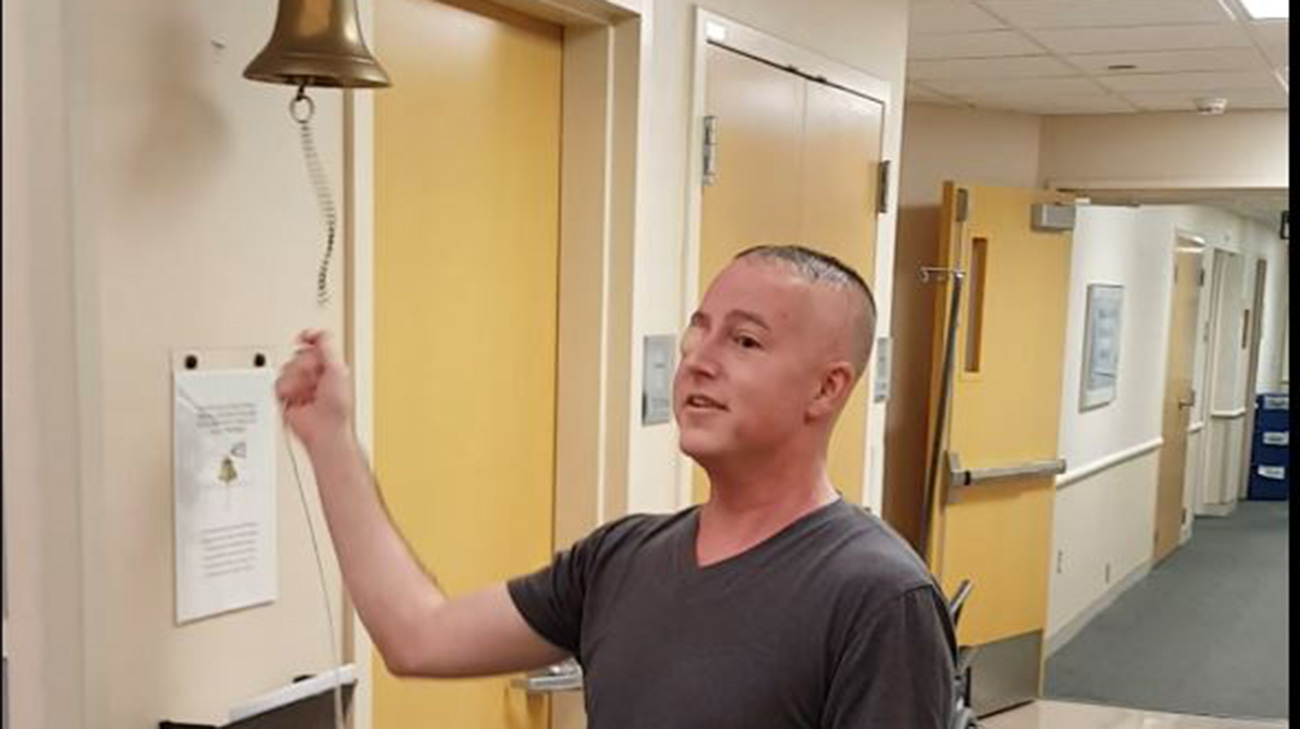 John ringing the bell after his final radiation treatment at Cleveland Clinic.