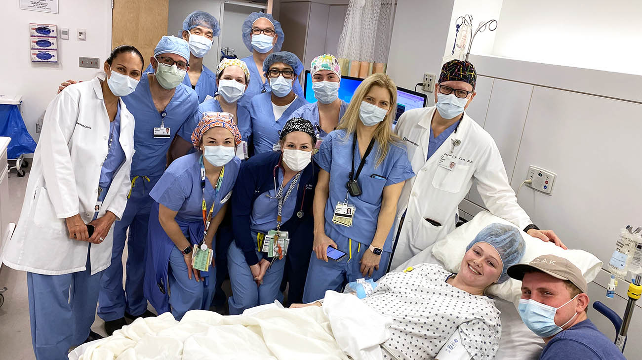 Kassidy, her husband, John, and Kassidy's Cleveland Clinic care team. 