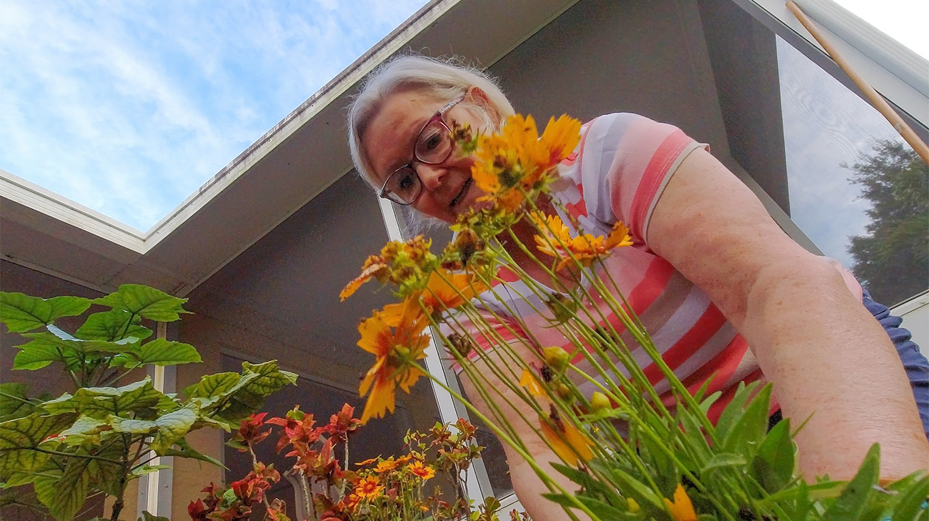 Debra Haberstroh works in her garden after her tumor resection.