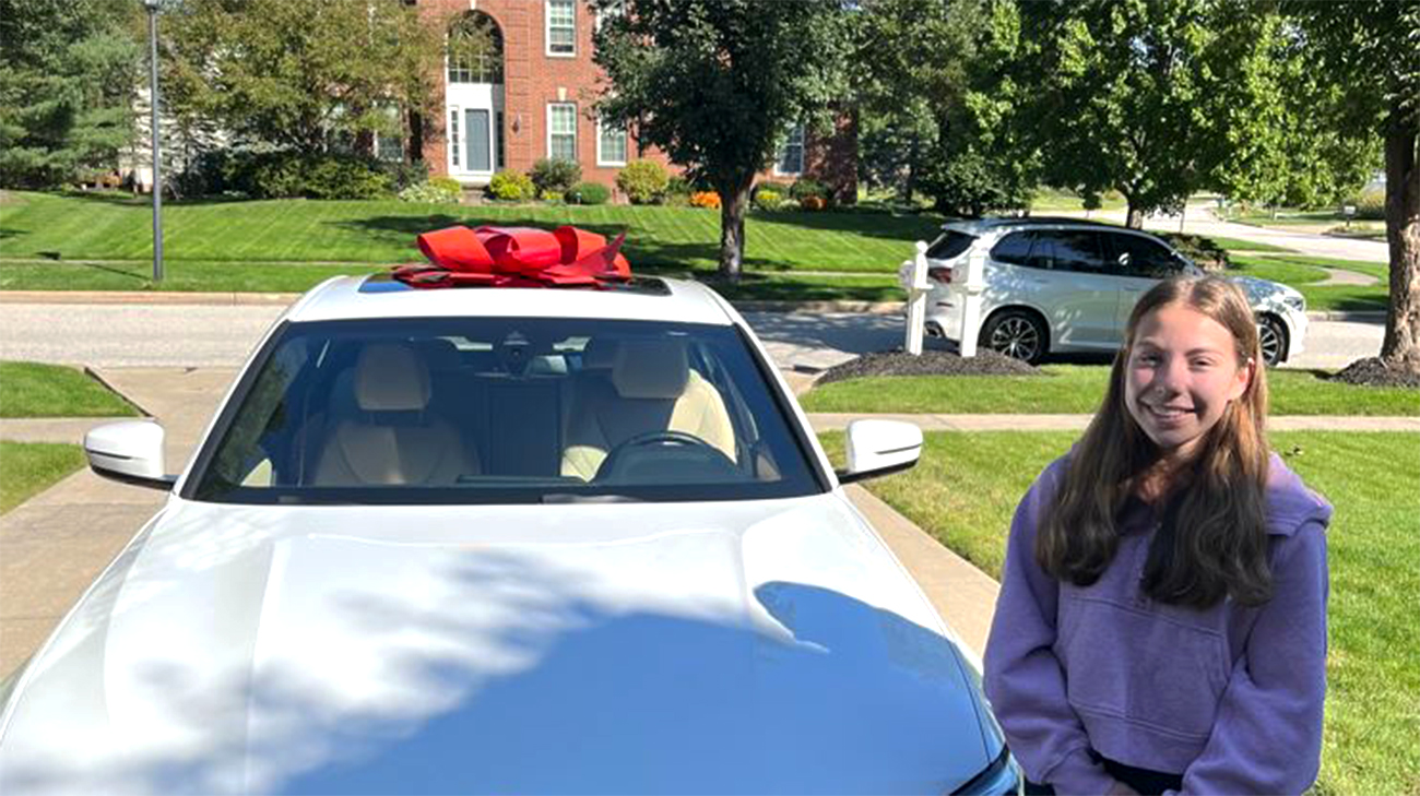 Isabella with her car after she got her driver's license. 