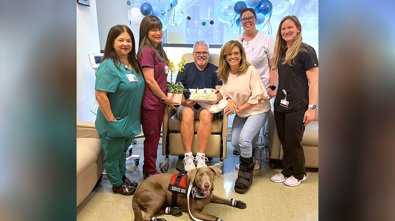 Dan and his care team celebrate the successful completion of his 18-month treatment with lecanemab. 